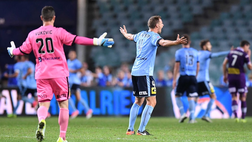 Danny Vukovic and Alex Wilkinson appeal during Sydney FC's A-League semi-final