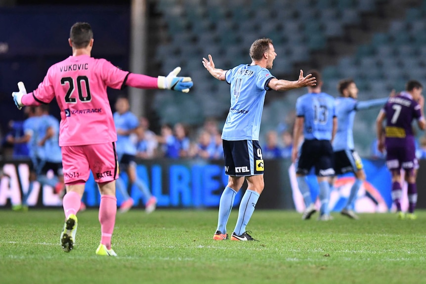 Danny Vukovic and Alex Wilkinson appeal during Sydney FC's A-League semi-final