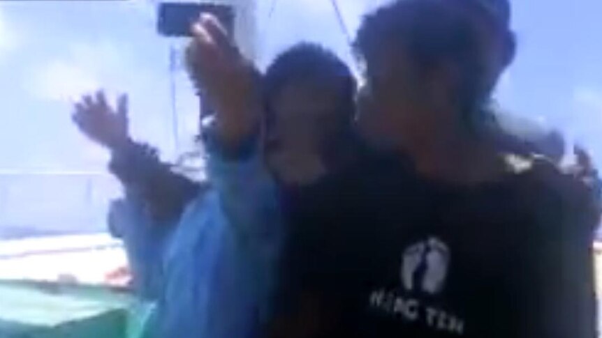 Men taking selfies after shooting dead men in ocean, uploaded Aug 19 2014