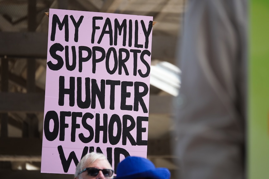A placard that reads 'my family supports Hunter offshore wind'