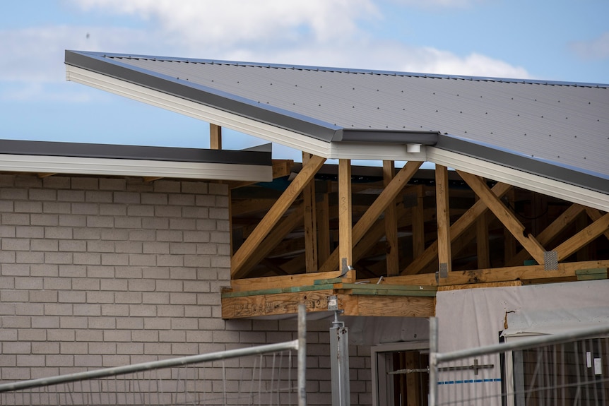 Roof under construction at home building site.