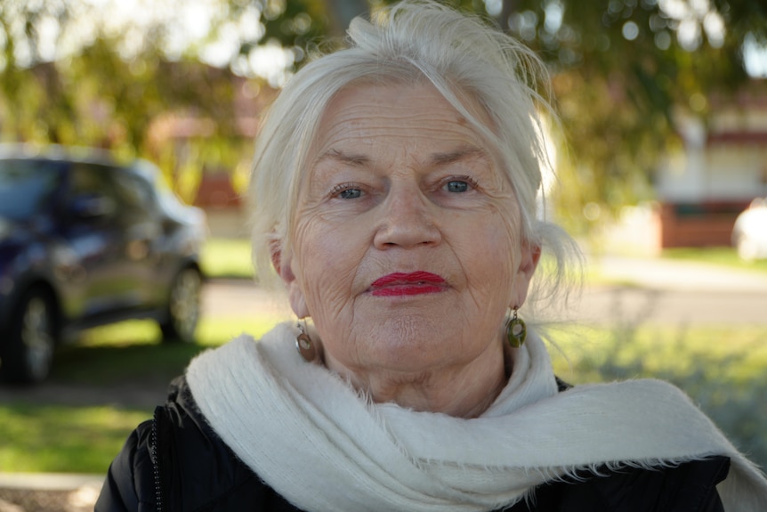An older woman named Irene Dornan looks directly at the camera. 