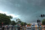 Storm clouds linger over a traffic intersection in Penrith