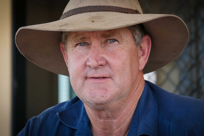 Rodney Hindle looking into the camera, with a wide brim hat on.