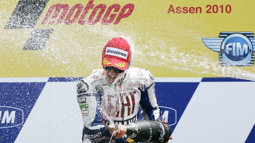 Spanish rider Jorge Lorenzo celebrates with champagne after winning the Dutch MotoGP race.