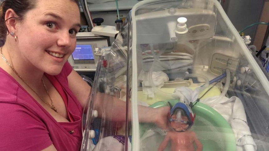 Hobart mother Erin Hill with one of her twins born at 25 weeks.