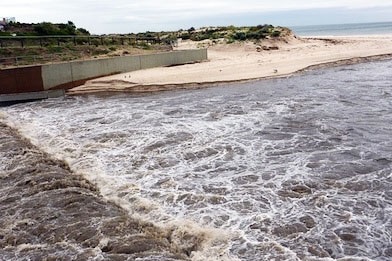 Stormwater runs from the Torrens into the Gulf off Adelaide