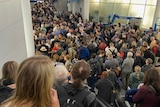 People stand in long queues at Chicago's O'Hare International Airport.