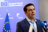 Greek Prime Minister Alexis Tsipras talks to the media at the end of an eurozone summit over the Greek debt crisis.