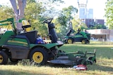 Two Darwin Council mowers left at the scene where a man suffered facial injuries in a freak accident.