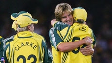 Brett Lee (front) congratulates Nathan Bracken on taking the wicket of Brian Lara