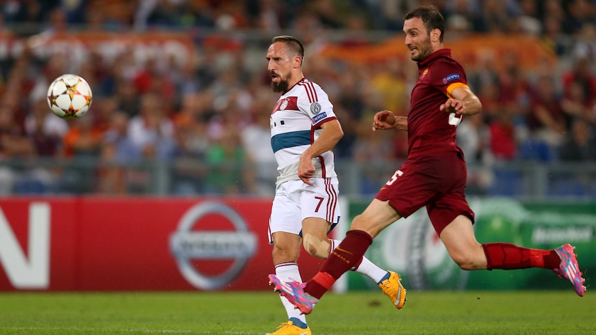 Bayern Munich's Franck Ribery (L) scores his side's sixth goal against Roma in the Champions League.