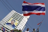Thailand protester waves flag