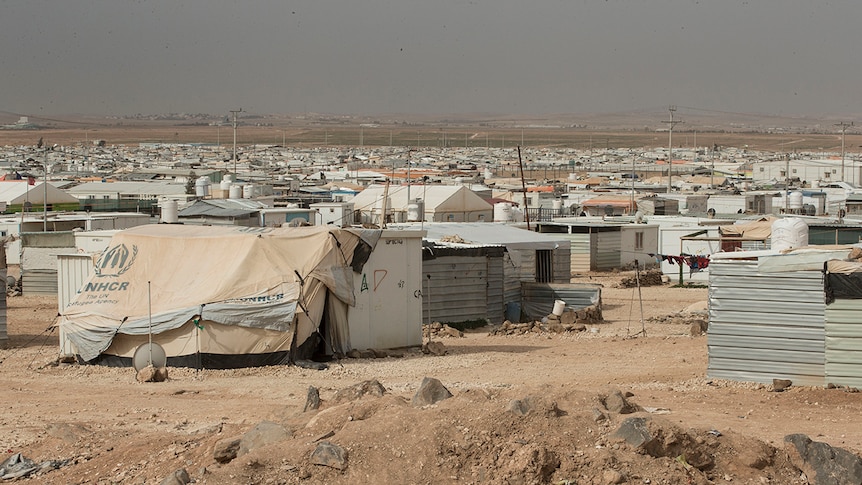 A view of the Zaatari refugee camp with temporary buildings made from corrugated iron.