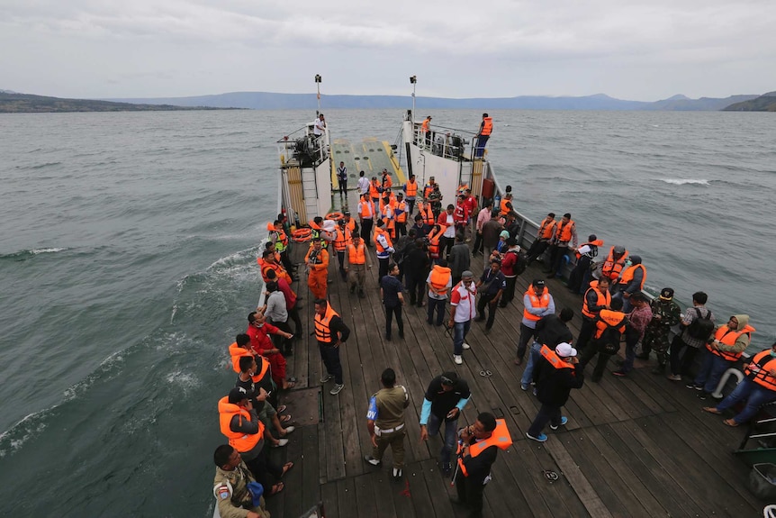 An Indonesia search and rescue team searches survivors from a sunken ferry.