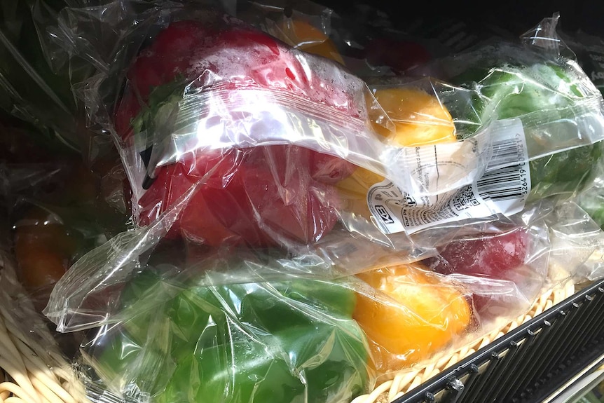 Plastic packets of capsicums in the supermarket