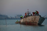Crews float the MV Rushcutter in Darwin Harbour.