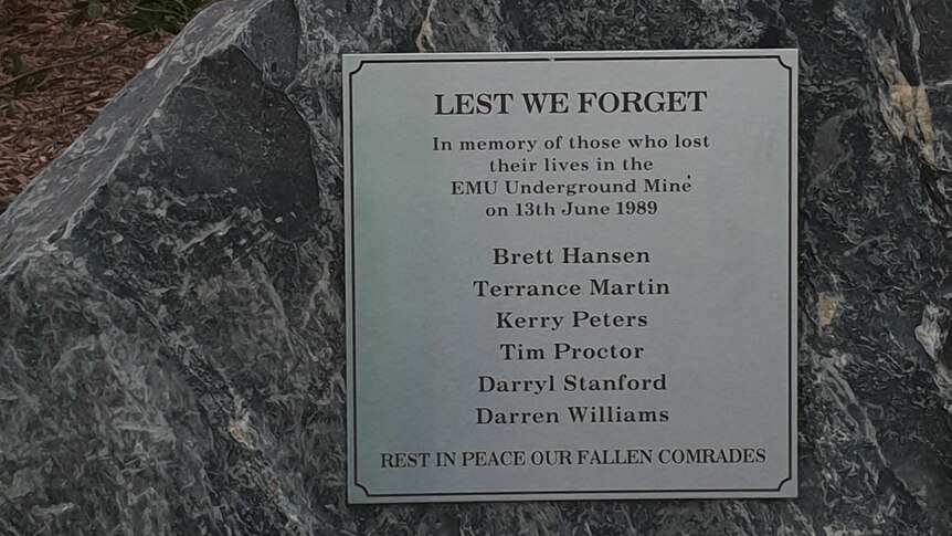 A plaque with the names of six dead mine workers.