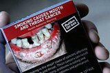 Graphic new warnings on cigarette packages - mouth cancer risk.