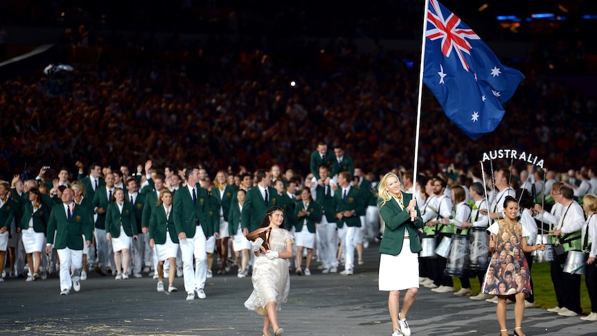 Flagbearer Lauren Jackson leads the Australian team into the stadium.