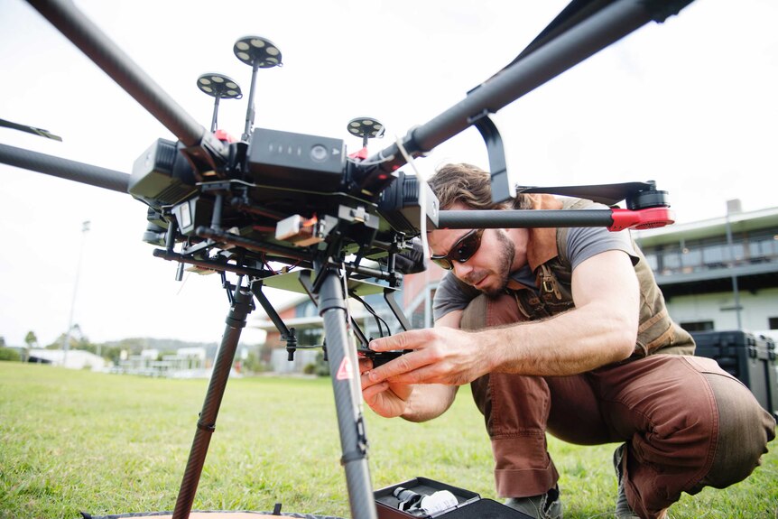 Southern Cross University researcher Dr Andrew Colefax with a drone