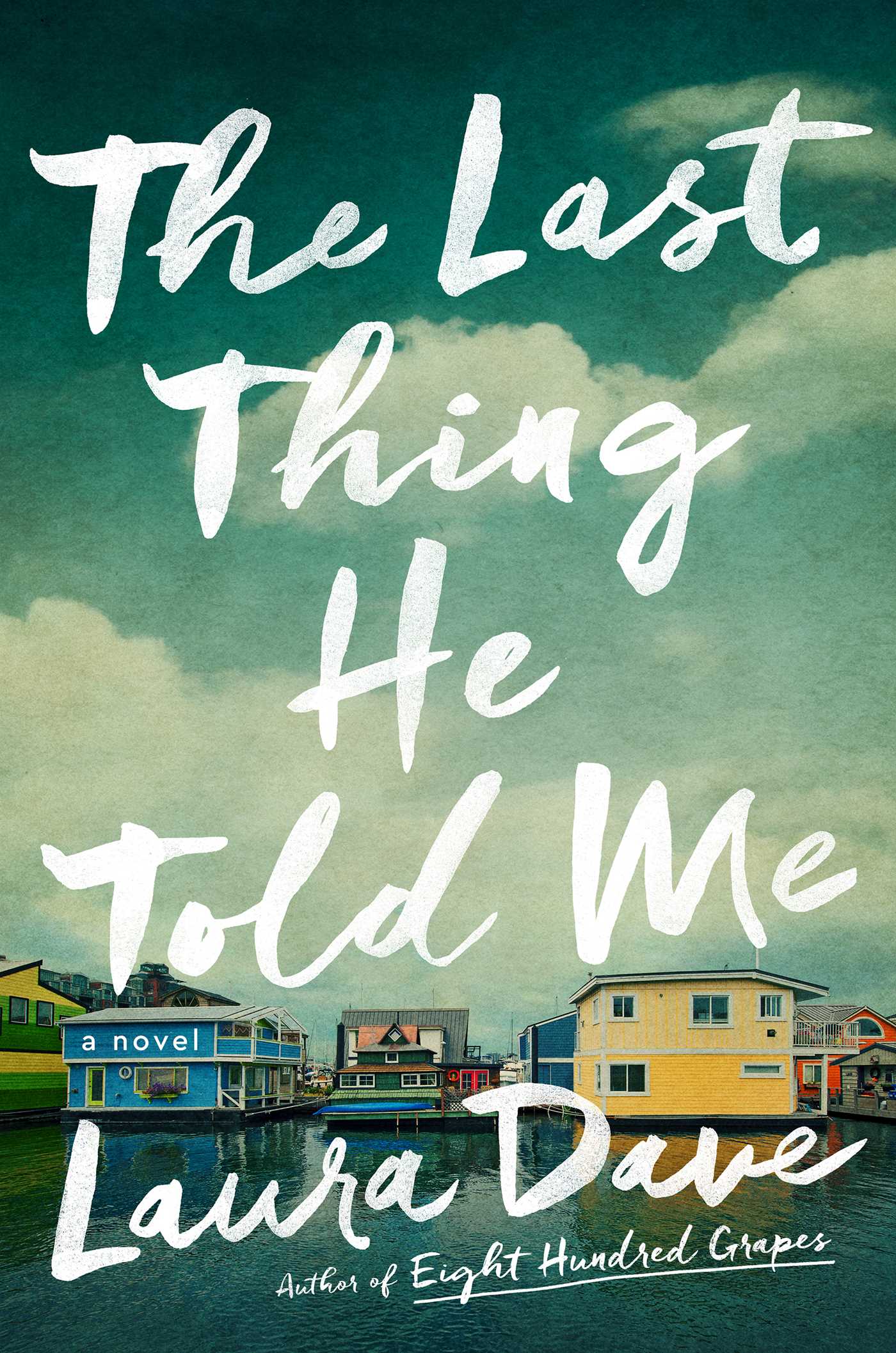 The cover of the book, featuring a sea side town and the title written in white writing.
