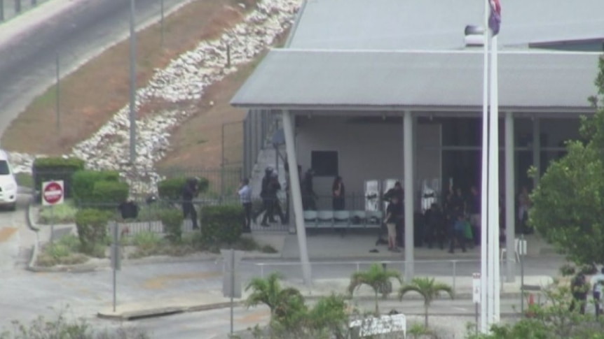 Riot police enter Christmas Island compound