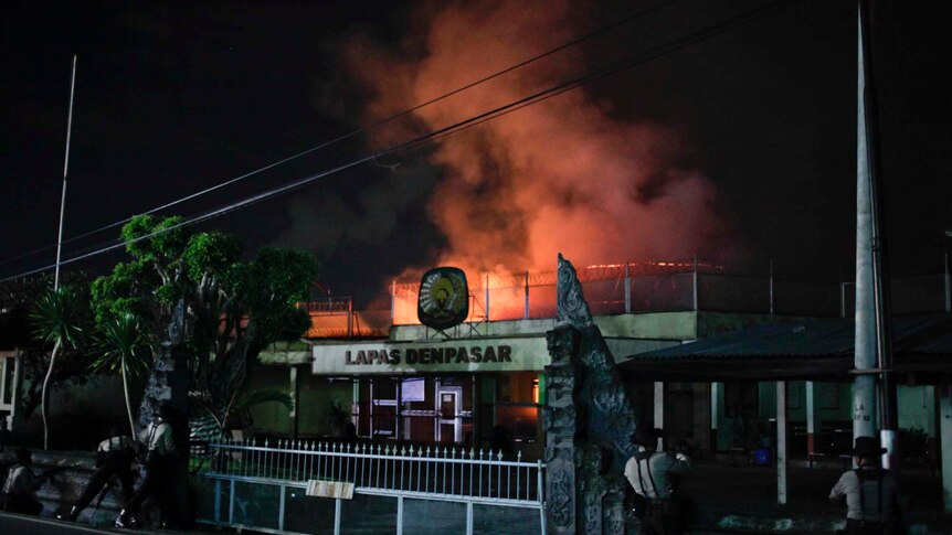Flames and smoke billow from Bali's Kerobokan prison during rioting