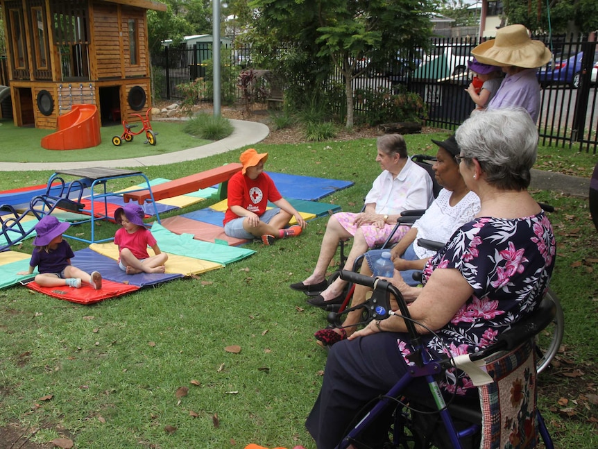 Red Cross volunteer Sara with children and seniors