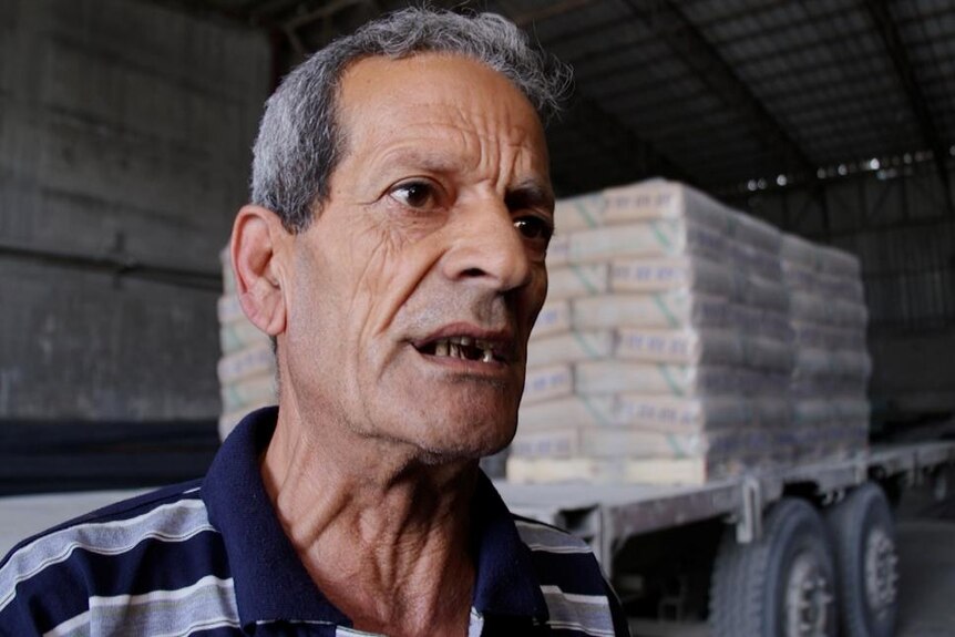 Abdel Rahman, an older Gazan man with missing front teeth, speaks to the ABC.