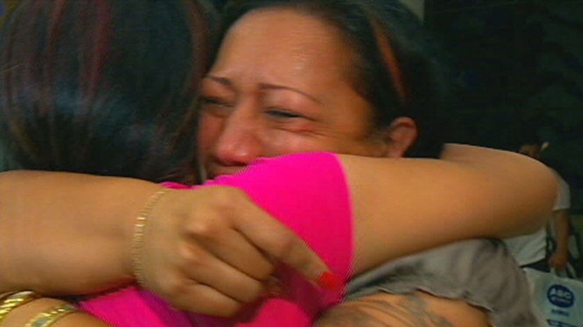 Relieved to be home: Samoan tsunami survivors at Sydney airport