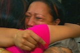 Relieved to be home: Samoan tsunami survivors at Sydney airport