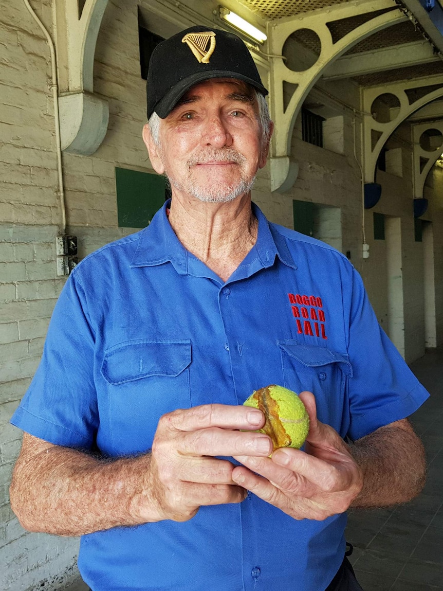 Larry Campbell holds a tennis ball inside Boggo Road Jail