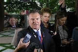 One Nation senator Rod Culleton speaks to reporters in the Parliament House courtyard
