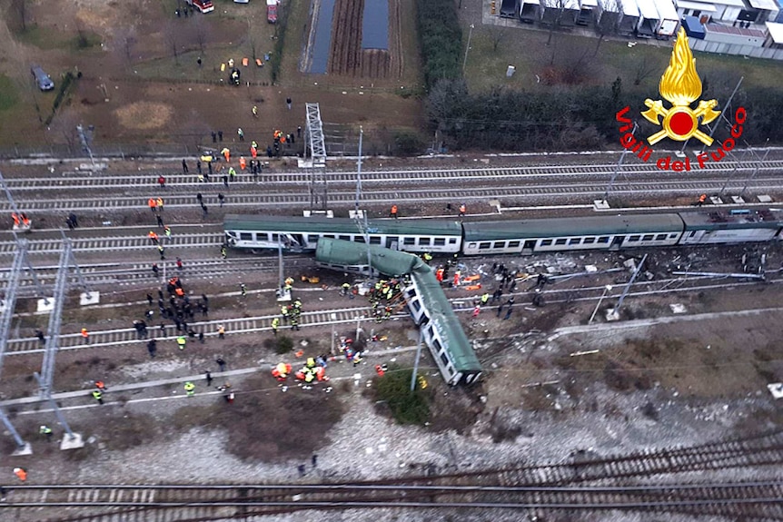 An aerial view shows a derailed train at the station of Pioltello Limito.
