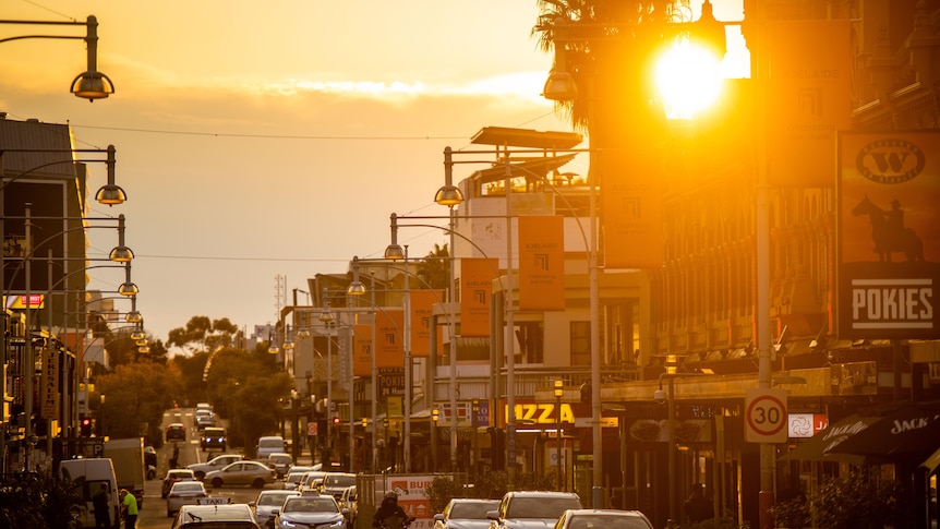 The sun beams through buildings on Adelaide's Hindley Street.