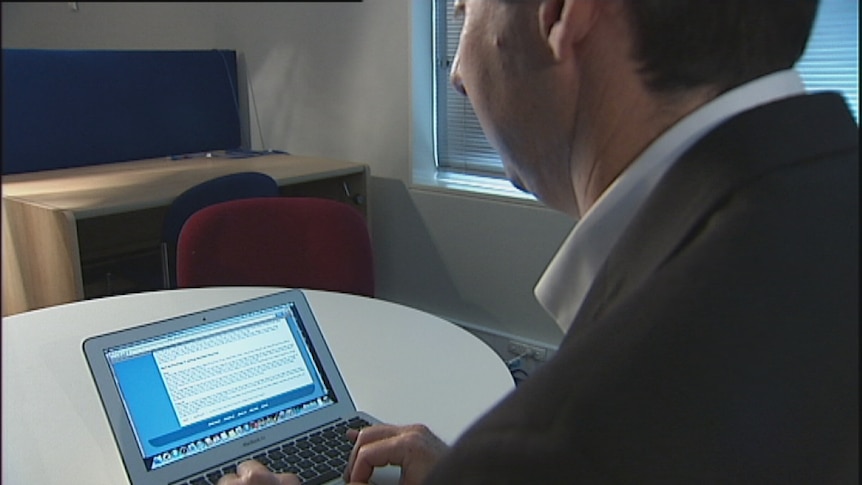 Video still: Generic of an unidentified man using a lap top computer to access the internet. Jan 2013.