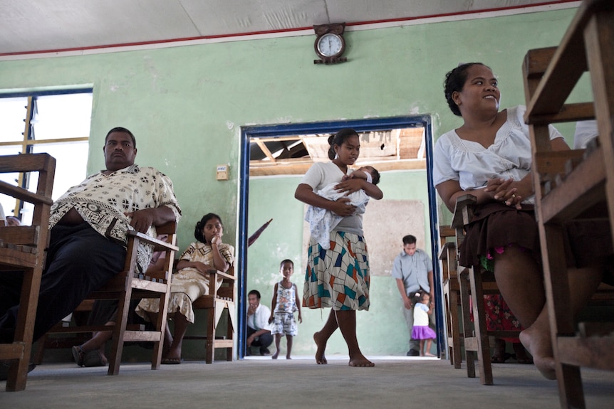Community members of Bikenikora Village in Kiribati attend church.