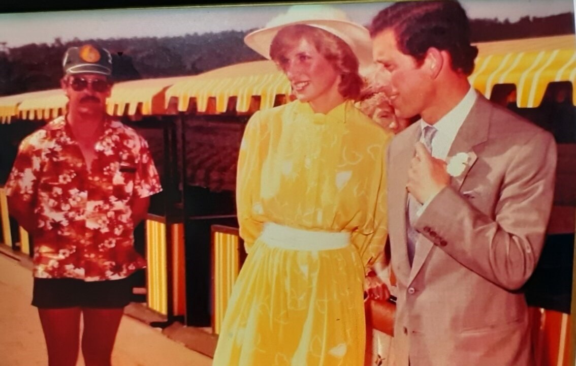 Man in bright hawaiian shirt beside Princess Di and Prince Charles