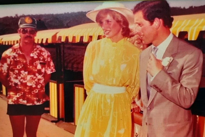 Man in bright hawaiian shirt beside Princess Di and Prince Charles