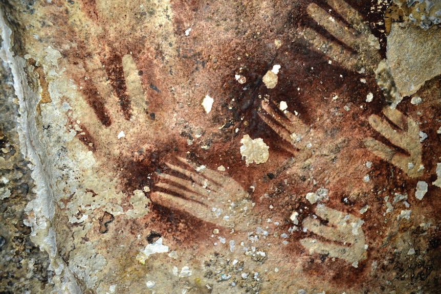 Hand prints on rock