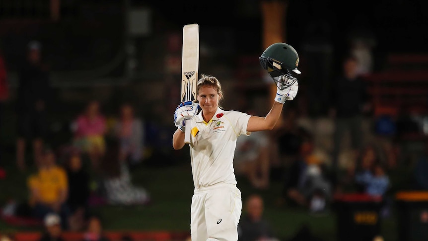Ellyse Perry raises her bat after she thought she had reached her double century against England in the Women's Ashes Test.