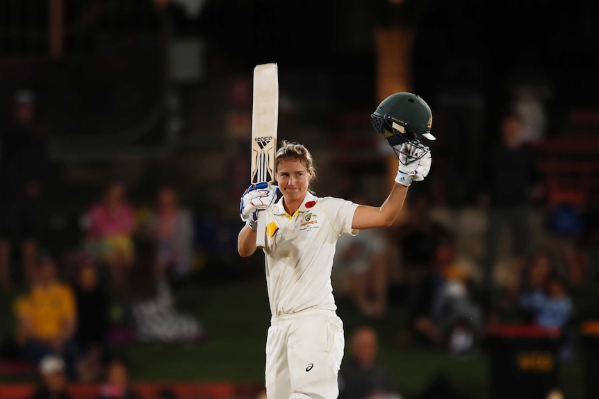 Ellyse Perry raises her bat after she thought she had reached her double century against England in the Women's Ashes Test.