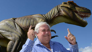 CUSTOM 320x180 of Clive Palmer standing in front of dinosaur at Coolum resort