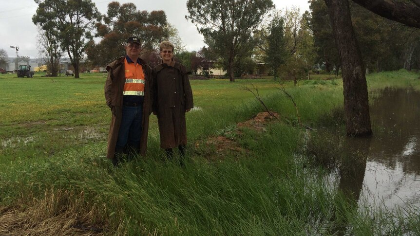 Farmer Paul Doust and his wife Robyn say their property is completely surrounded by water.