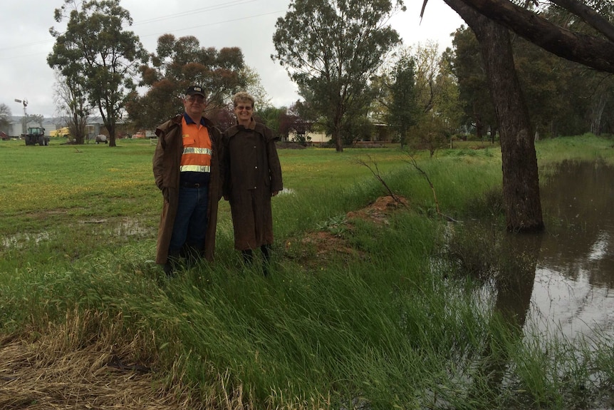 Farmer Paul Doust and his wife Robyn say their property is completely surrounded by water.