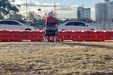 woman sitting on walker at the border