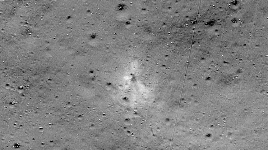 A grey image of the moon's surface, with a faint splodge in the middle, which is where the lander crashed.