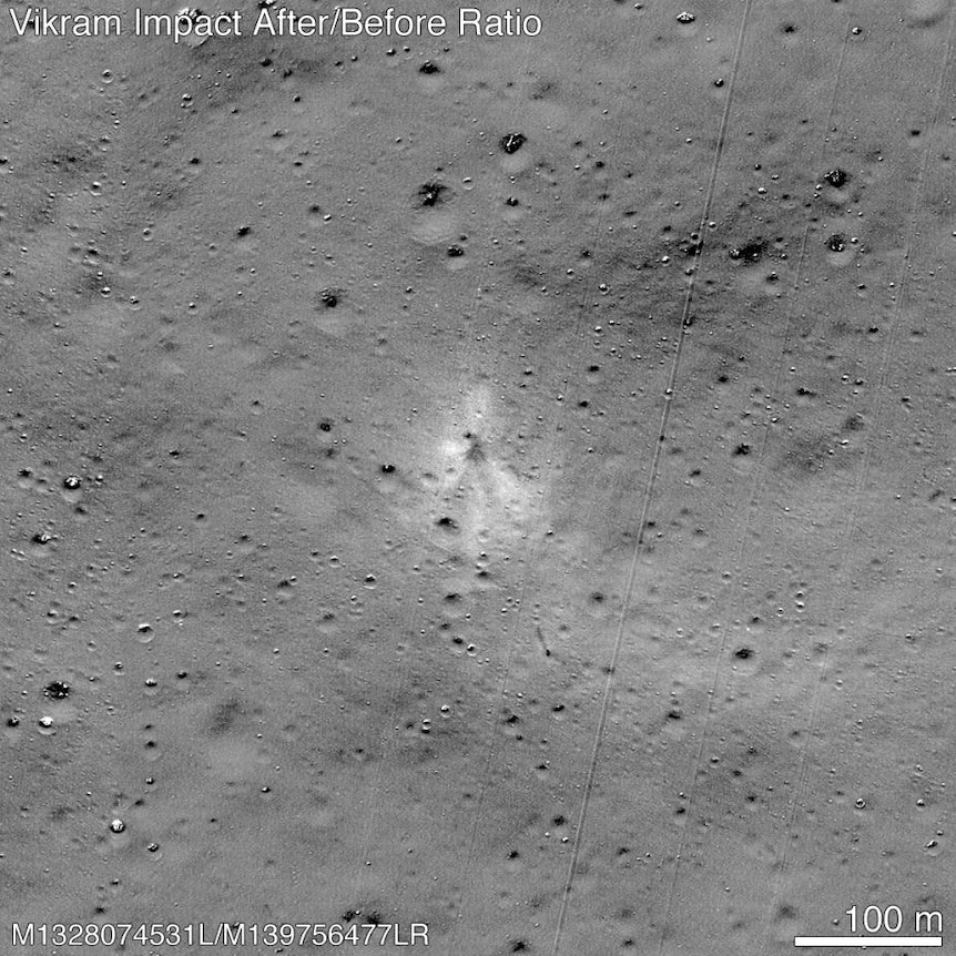 A grey image of the moon's surface, with a faint splodge in the middle, which is where the lander crashed.