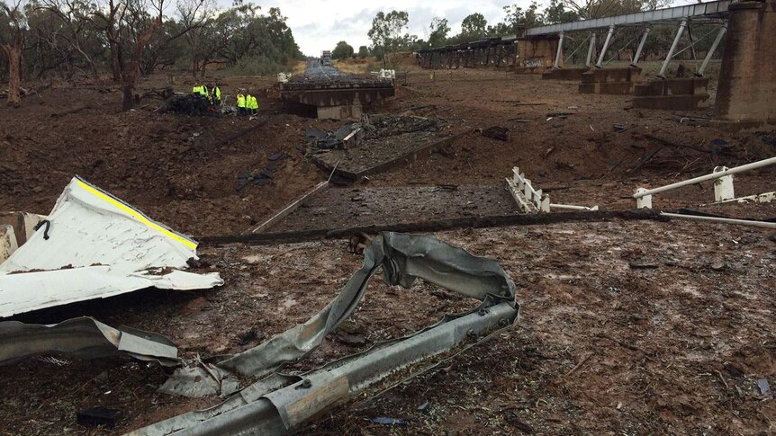 Emergency crews in crater at scene of major truck explosion south of Charleville in south-west Queensland